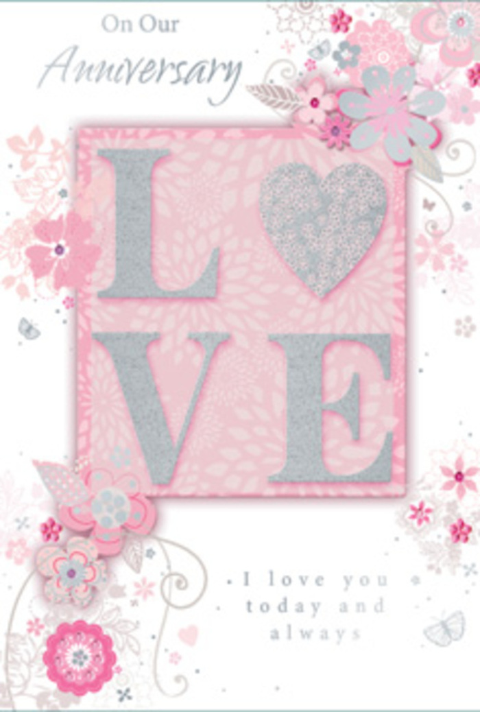 The photograph captures an open anniversary card that feels like stepping into a sunlit room where love is part of the everyday rhythm of life in Raynes Park. On the right-hand side, the main motif spells out LOVE in large, frosted glitter letters, each one slightly raised so it can be felt under the fingertips, much like the textured petals of a fresh bloom. The glitter is soft and refined rather than bold, catching the light with a delicate shimmer similar to early sunshine resting on wet pavements near Raynes Park station. Around this central word, wispy, hand-drawn flowers drift along the borders in shades of blush pink, lilac, and creamy ivory. Their slender stems and fine leaves curl and overlap, suggesting the natural flow of a hand-tied bouquet being arranged by an experienced florist. Tiny filigree flourishes intertwine with the blooms, with dainty leaves and near-hidden butterflies adding a sense of gentle movement, like a breeze through the trees by Cannon Hill Common. The background is a tender wash of pink, soft but luminous, offering a calm stage for the pastel flowers and glittering letters. Below and inside the illustration, the message I love you today and always appears in a graceful, understated typeface that invites a moment of pause and reflection. The card feels like a bouquet translated into paper: light, romantic, and thoughtfully composed, ideal for an anniversary shared quietly at home in Raynes Park, filled with gratitude, memories, and hope for all the days still to come.